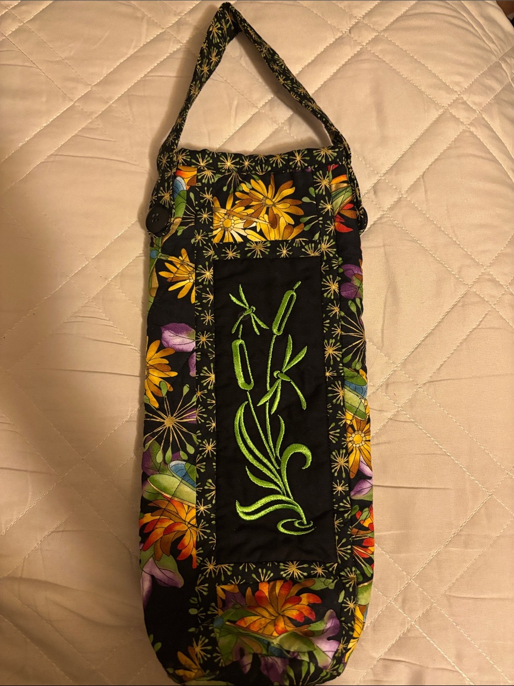Handmade quilted wine bag featuring intricate machine embroidery floral